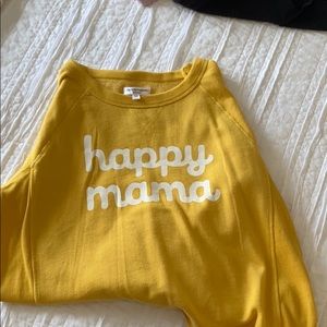 Long sleeved. Cropped to top of waist.